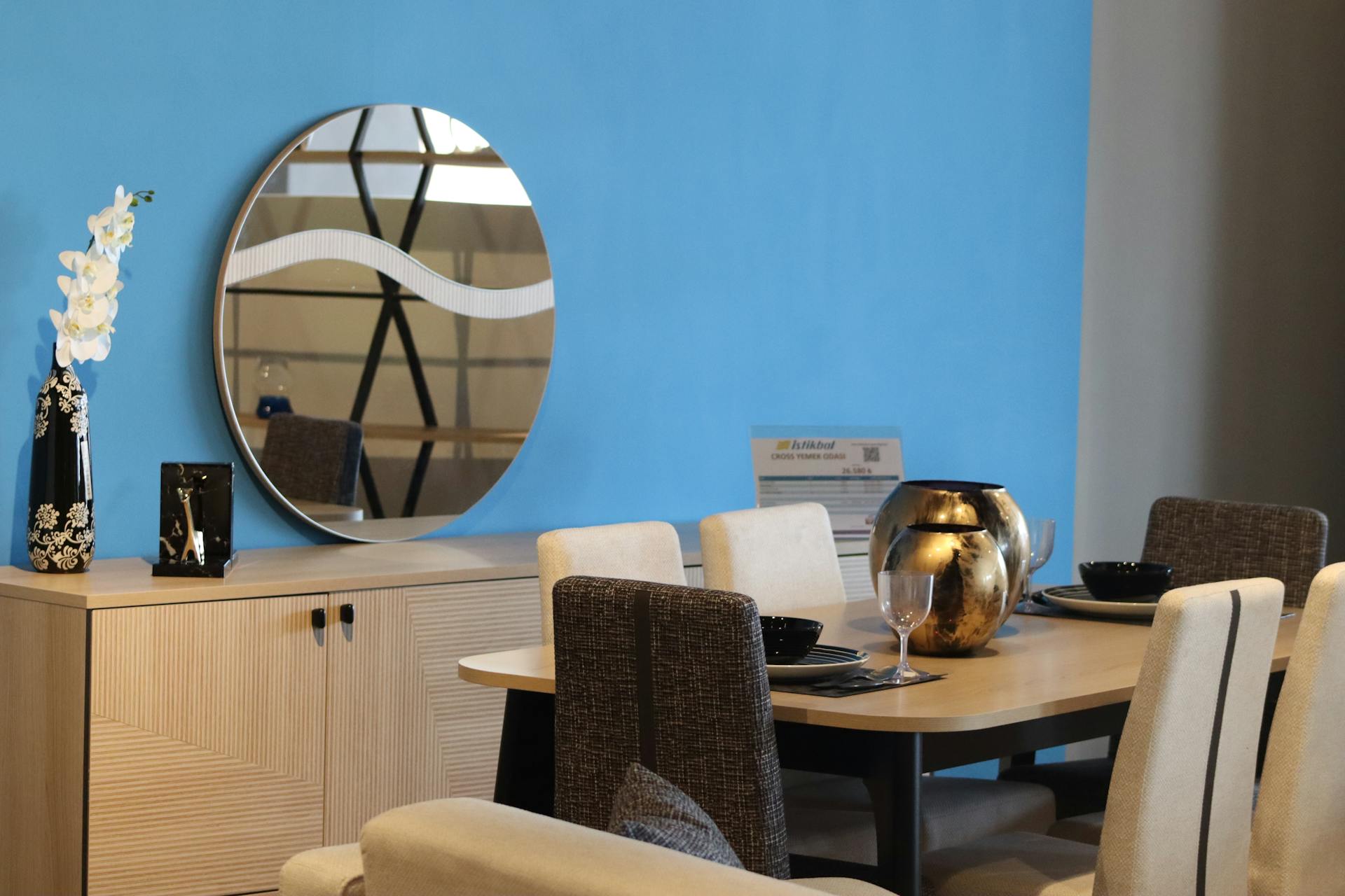Add A Round Mirror In The Dining Room