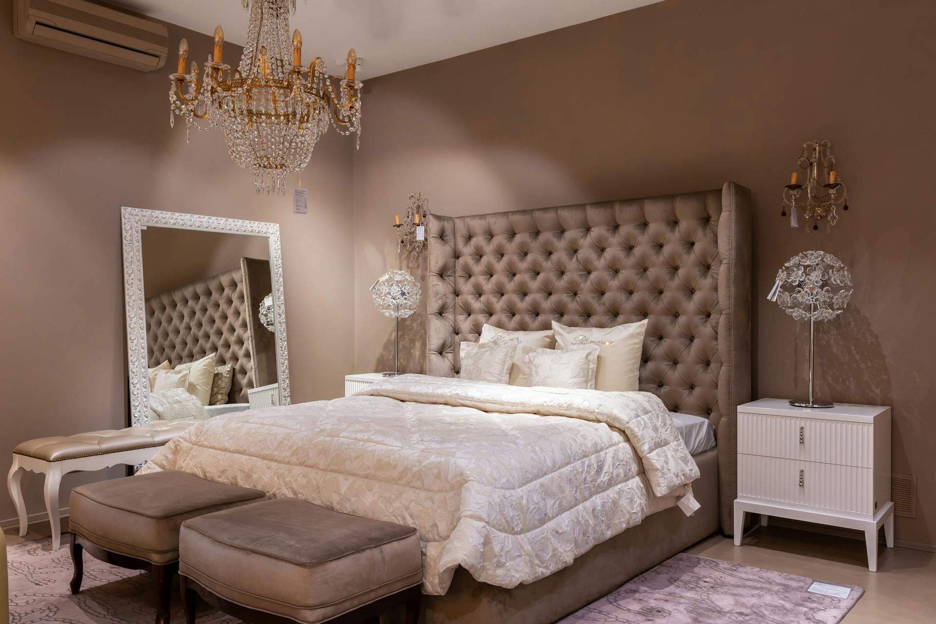 Hang An Oversized Mirror Behind The Bed