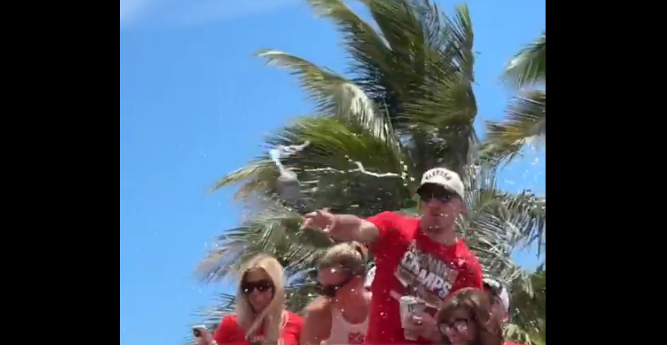 Parade: Brad Marchand fends off a beer thrown at him