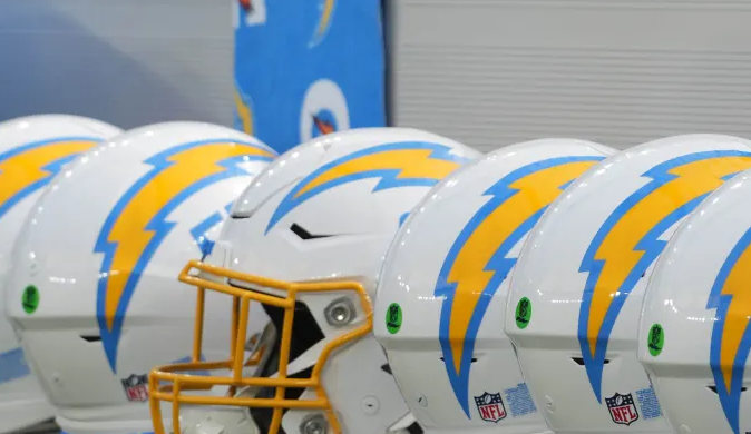 He signs a contract with the Chargers before retiring