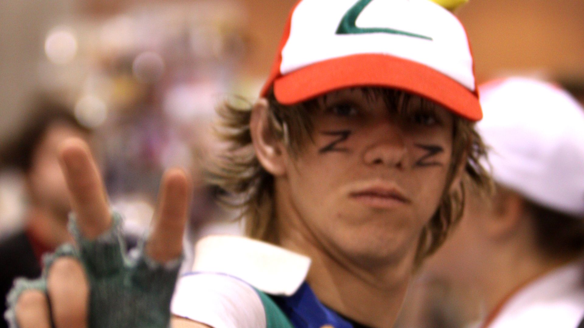 1. Ash Ketchum avec casquette et gants rouges