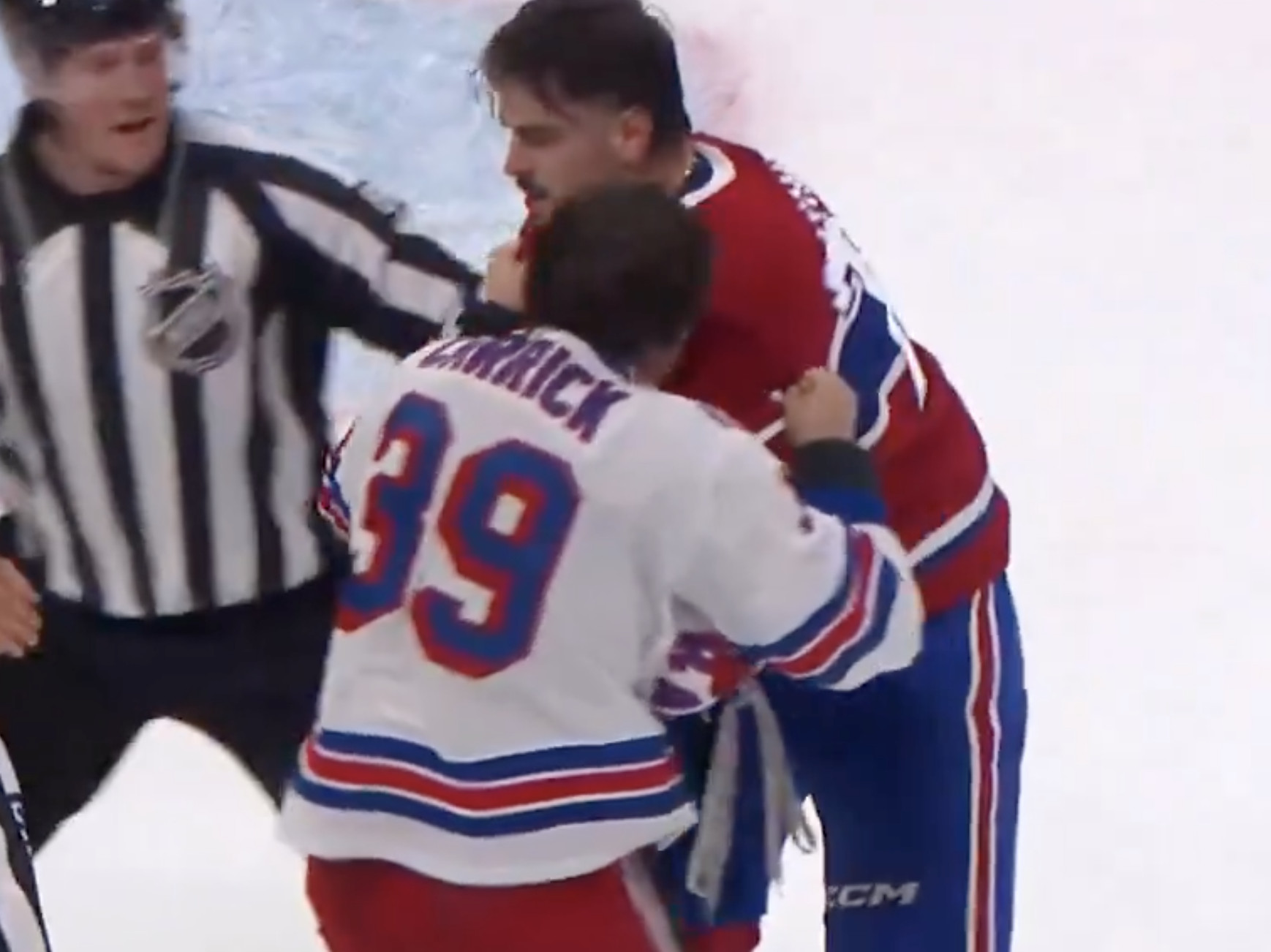 Arber Xhekaj protects Lane Hutson and throws off the gloves