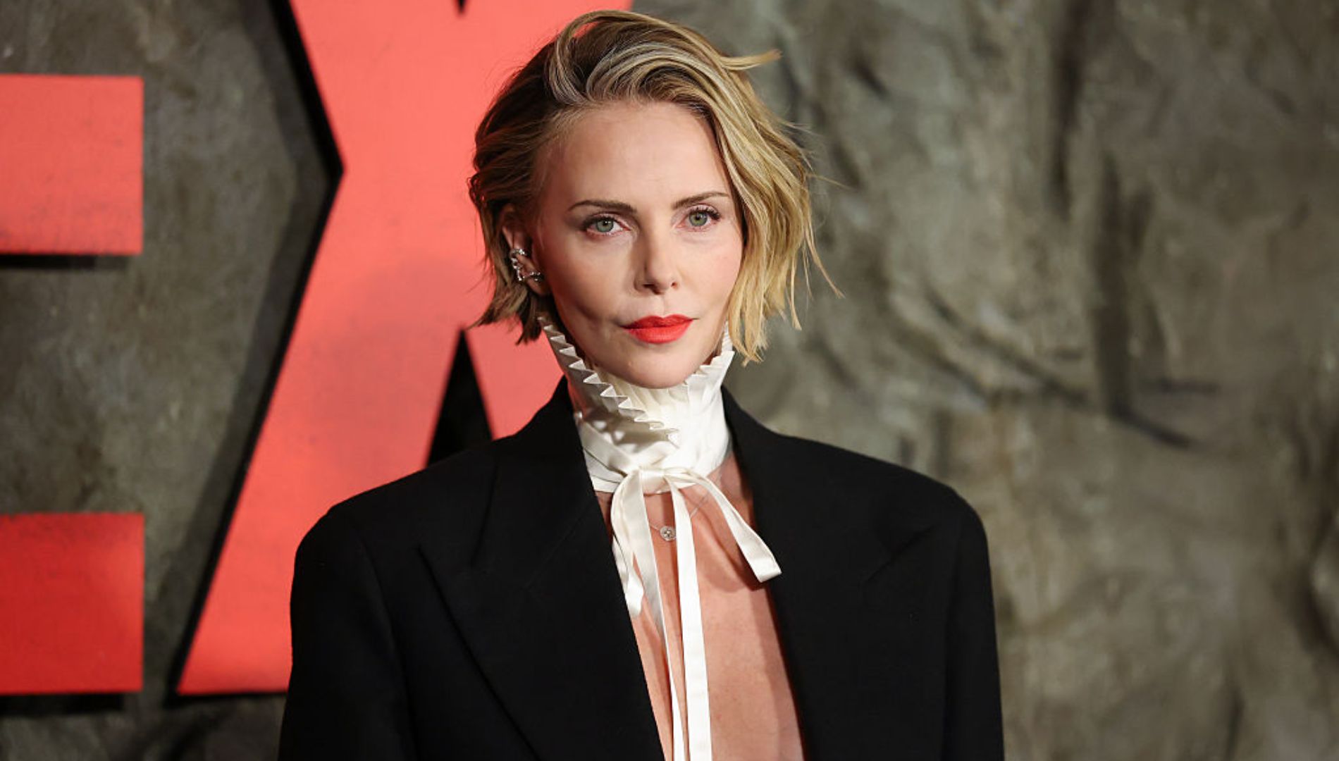Charlize Theron shines at the premiere of Apex
