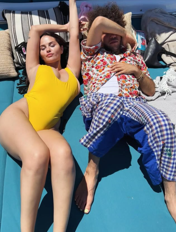 looking stunning in her yellow one-piece swimsuit