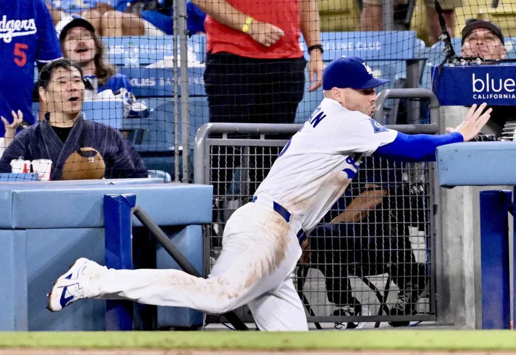 A Worrying Moment: Freddie Freeman Falls in the Royals’ dugout