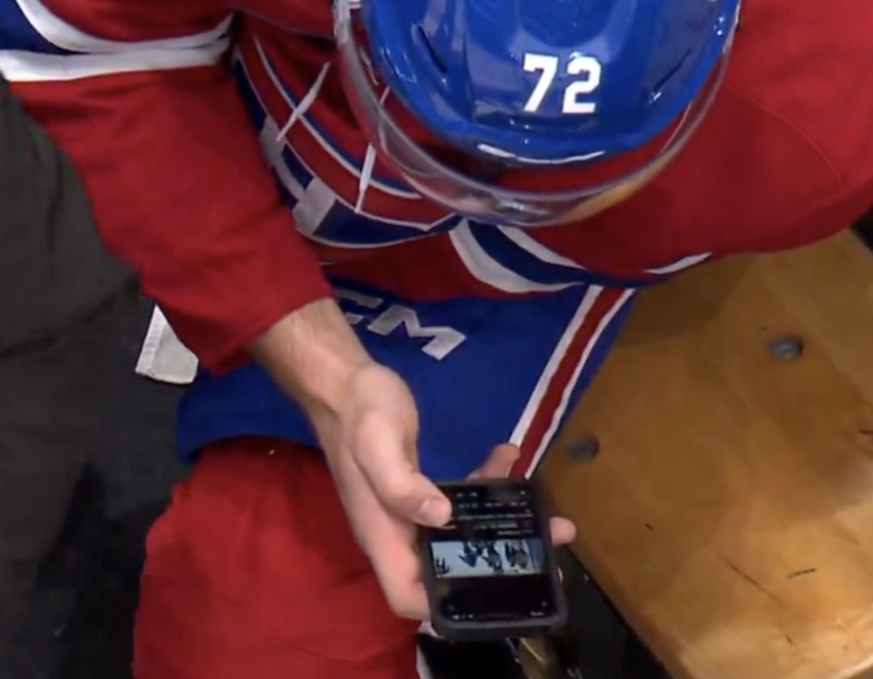 Arber watched Florian’s fight from the penalty box… on his cell phone