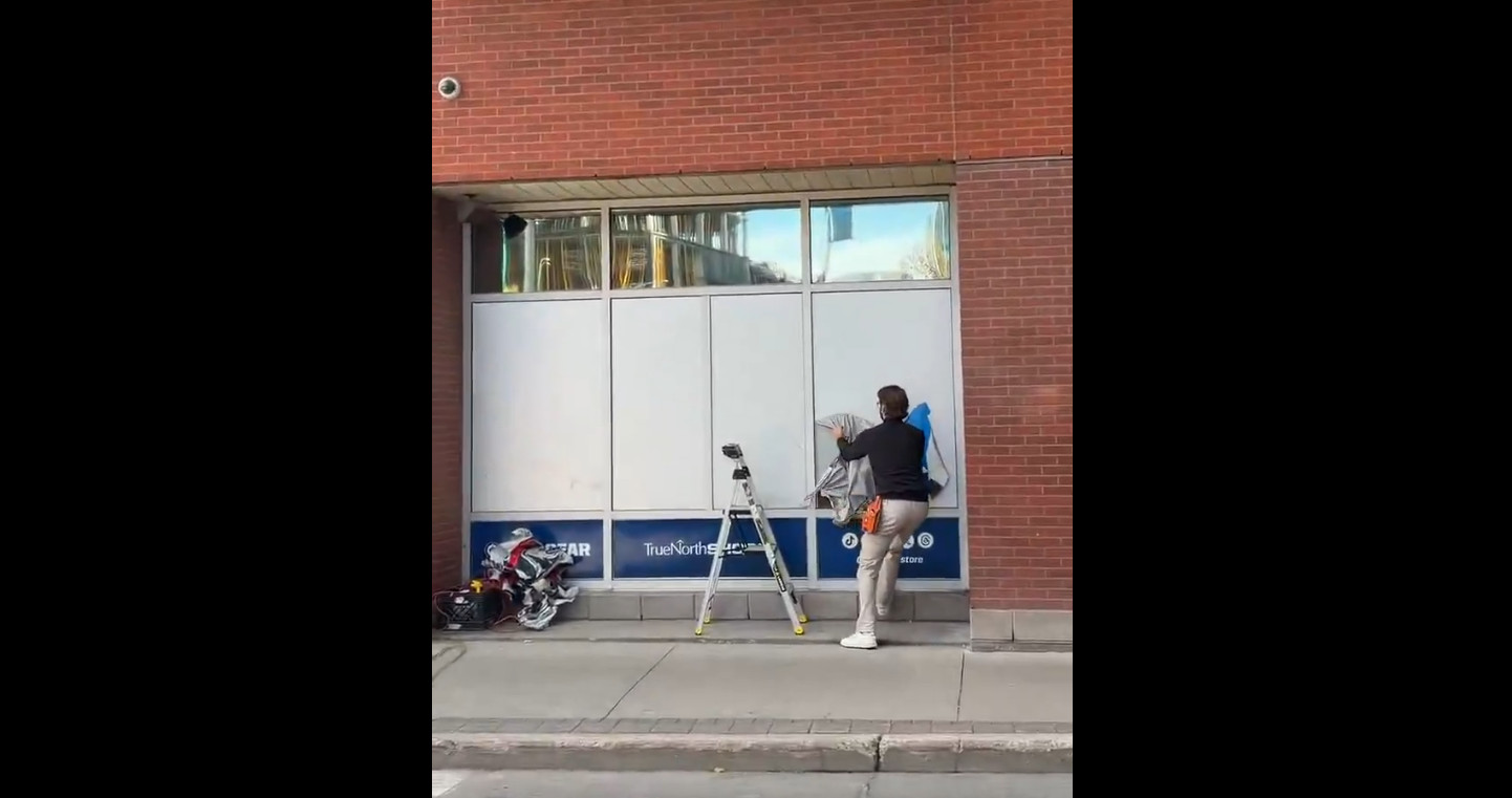 Connor Hellebuyck: His photos were removed from the Canada Life Centre