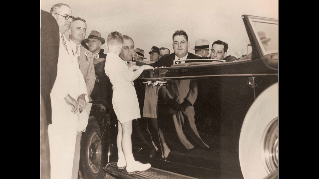 14. Teens Rode Perched On A Car's Running Boards