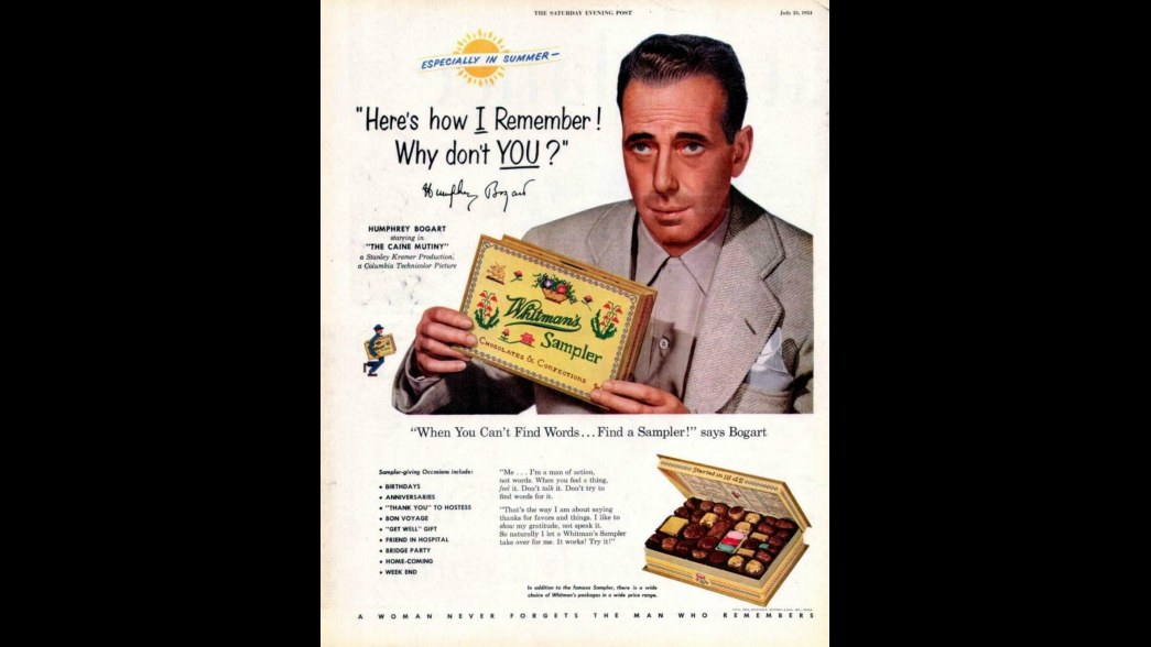 11. Humphrey Bogart Posed With A Box Of Whitman's Chocolates