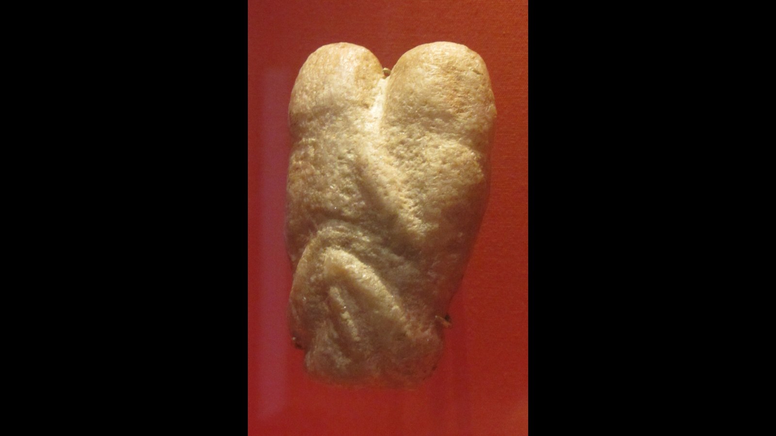 13. An 11,000-Year-Old Stone Carving Captures An Ancient Embrace