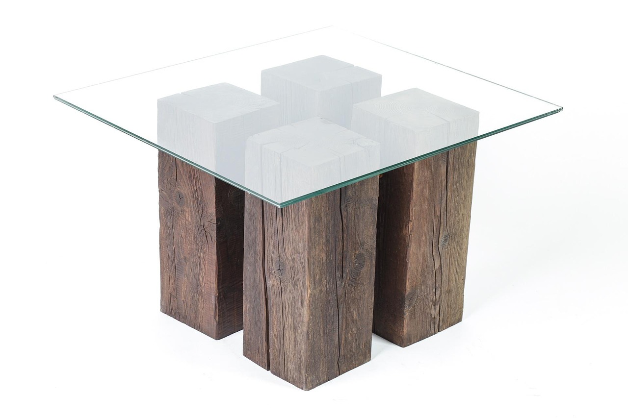 9. The glass table with a heavy central base
