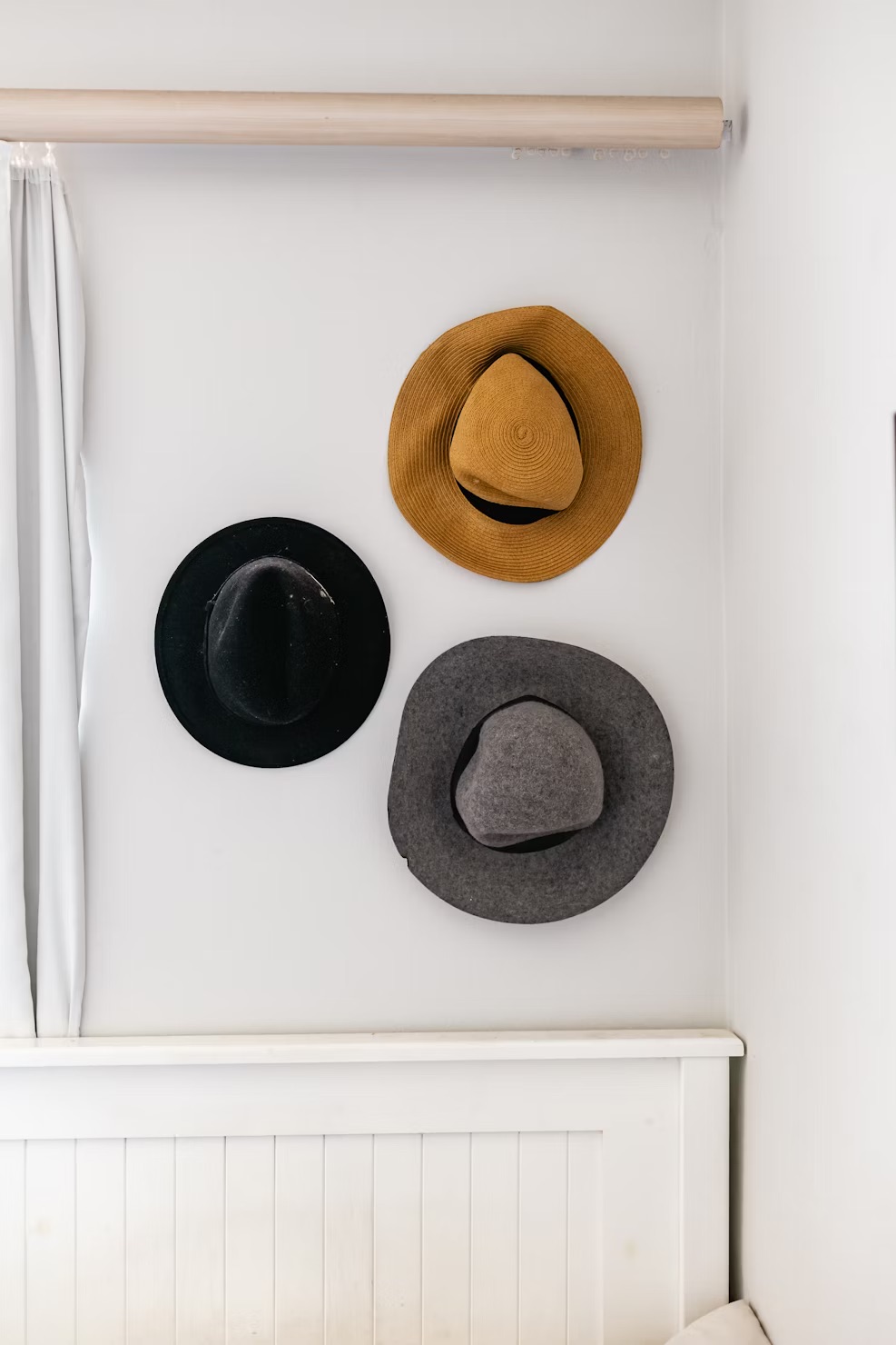 A wall-mounted hat rack